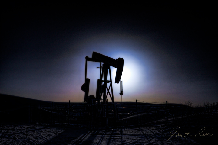 PumpJack Silhouette At Sunset