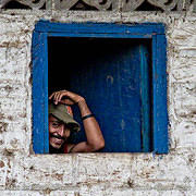 Man in Blue Window