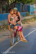 Couple With Baby On Bike